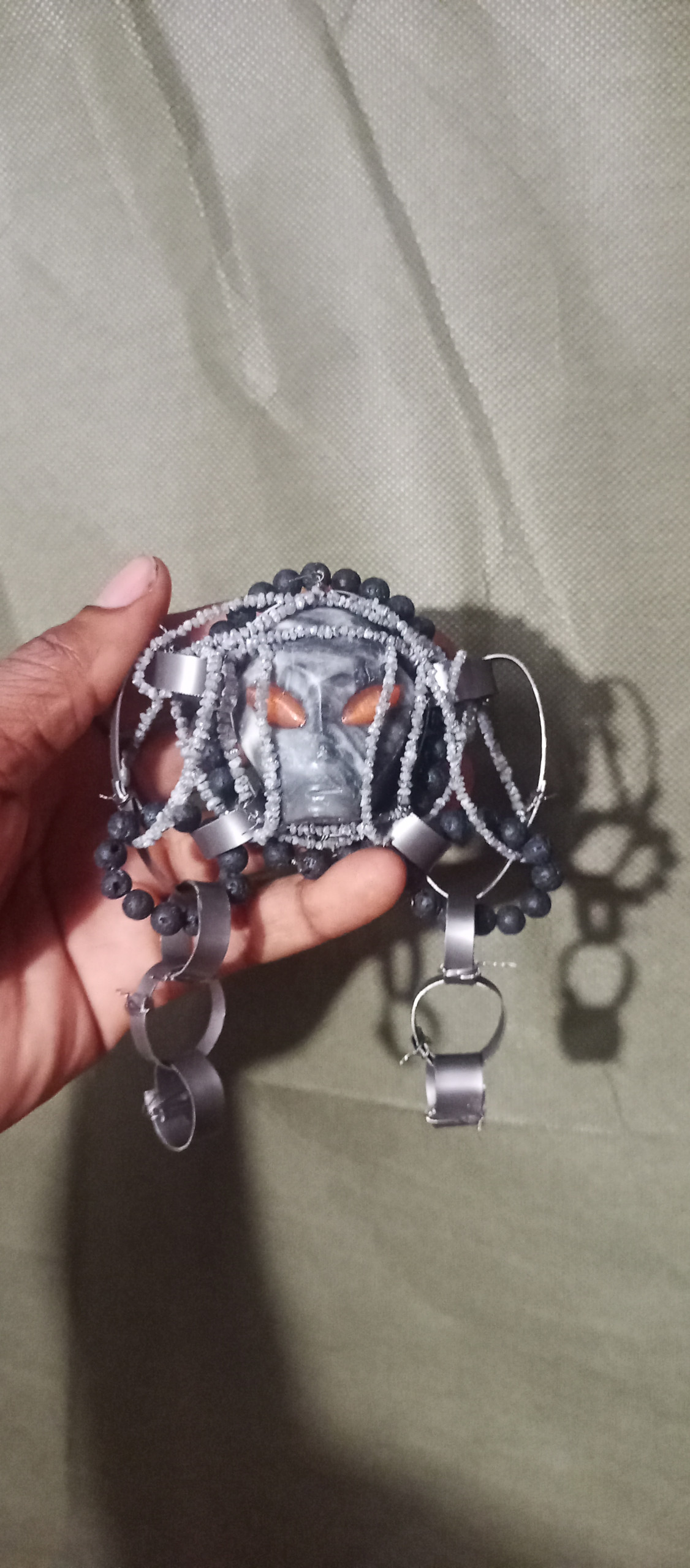 Clothing, Glove, Baseball, Baseball Glove, Sport, Body Part, Finger, Hand, Person, Baby, Face, Head, Accessories, Jewelry, Necklace, Bracelet, Skin, Tattoo, Wristwatch, Silver, Back, Sphere, Bead, Prayer, Prayer Beads, Footwear, Sandal, Gemstone, Animal, Sea Life, Hat, Cuff, Ammunition, Grenade, Weapon, Wrist, Arm, Bag, Handbag, American Football, Football, Playing American Football, Belt, Purse, Harness, Bra, Lingerie, Underwear, Crystal, Buckle