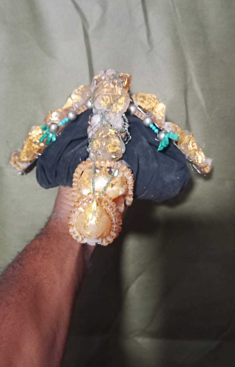 Clothing, Footwear, Sandal, Accessories, Jewelry, Diamond, Gemstone, Animal, Food, Invertebrate, Lobster, Sea Life, Seafood, Bracelet, Glove, Flip-Flop, Ring, Body Part, Finger, Hand, Person, Ornament, Earring, Cuff, Aluminium, Crystal, Wristwatch, Face, Head, Photography, Portrait, Turquoise, Sapphire, Bangles, Treasure, Gold, Silver, Foil, Anklet, Henna, Necklace