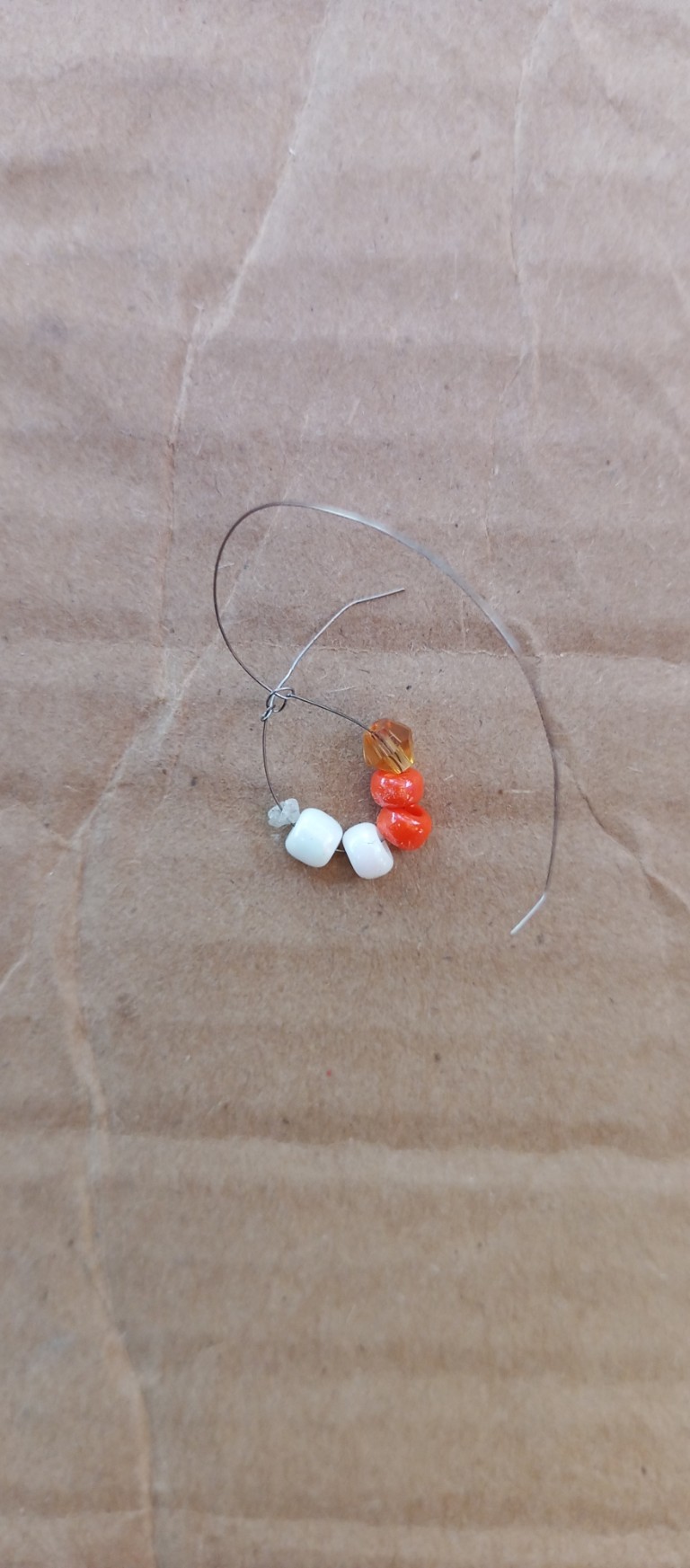 Accessories, Earring, Jewelry, Gemstone, Bead, Ornament, Necklace, Pebble, Silver, Bracelet, Mineral, Coil, Spiral, Wood, Crystal, Hoop, Food, Produce, Agate, Grain, Sphere, Cardboard, Seed, Sweets, Opal, Barbed Wire, Wire, Bead Necklace, Guitar, Musical Instrument, Plectrum, Candy