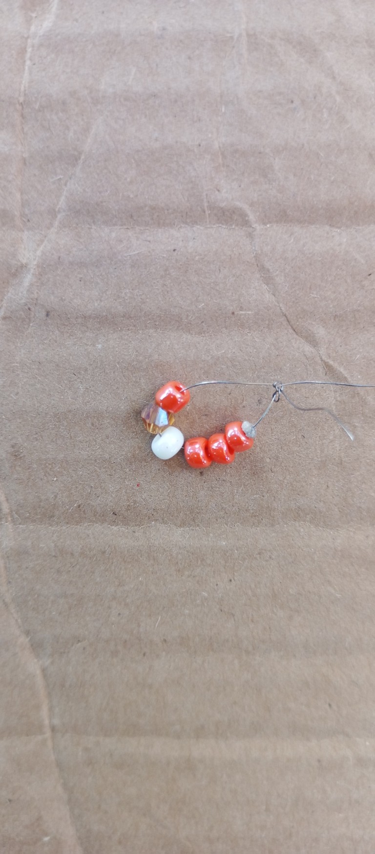 Accessories, Earring, Jewelry, Bead, Necklace, Food, Sweets, Gemstone, Ornament, Bracelet, Candy, Bead Necklace, Rock, Prayer, Prayer Beads, Box, Cardboard, Pebble, Animal, Invertebrate, Sea Life, Seashell, Produce, Floor, Beak, Bird, Grain, Weapon, Coil, Spiral, Balloon, Agaric, Fungus, Mushroom, Plant, Carton